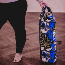 Load image into Gallery viewer, Woman holding a yoga bolster made of African prints
