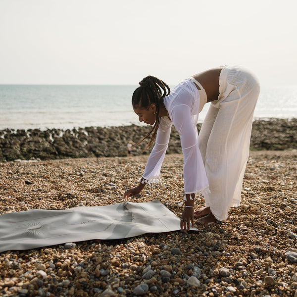 Load image into Gallery viewer, Ladina Yoga Warrior Black travel yoga mat laying on the ground
