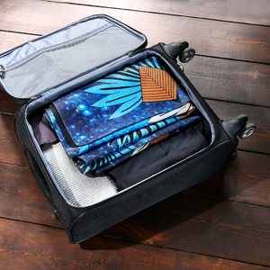 Ravinala travel mat folded in a suitcase