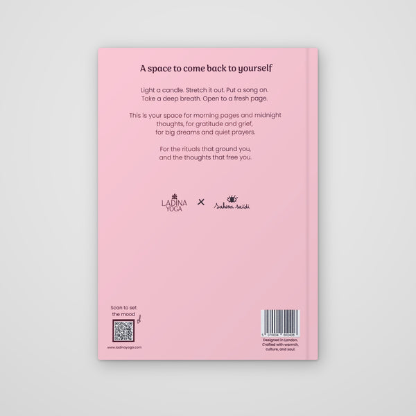 Load image into Gallery viewer, The back cover of a pink journal or notebook on a light gray background. The cover features black text with a title, a short affirmation, and several logos including 'Ladina Yoga' and 'Anubhava Yoga'.
